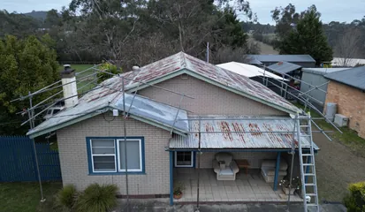 Rusted roof being repaired in the Yarra Valley